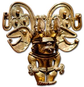 Anthropomorphical Pendant of the Tairona People, Representing a Shaman Holding Two Sceptres, Wearing a Large Nasal Ornament and a High Headgear with Two Toucans. Lost-Wax Cast Gold with False Filigree Decoration, 10th-15th Century, Colombia.