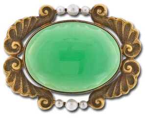 Early 20th Century Pin Centered with a Translucent Oval Cabochon Chrysoprase Chalcedony. Image Courtesy of Lang Antiques