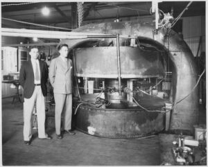 Professor Lawrence Next to his Cyclotron.