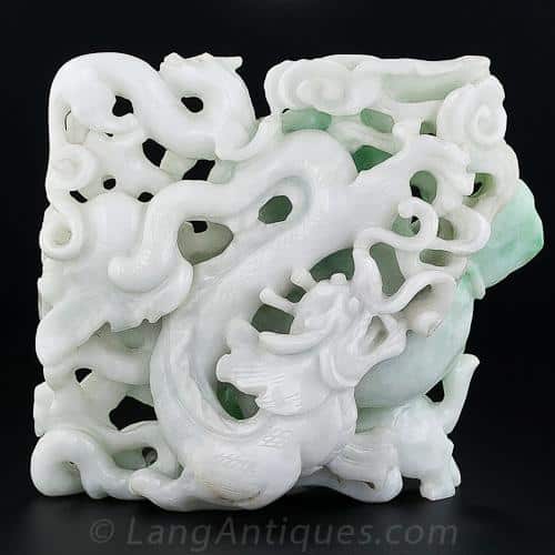 Double-Sided Jadeite Carving Depicting a Spectacular Ferocious Fire-Breathing Dragon.