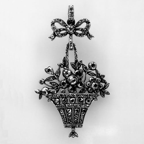 Pendant in the Form of a Flower-Filled Basket. Silver with a Closed-Back Set with Diamonds and a Central Rose on a Trembler Spring. Late 18th Century © Trustees of the British Museum.