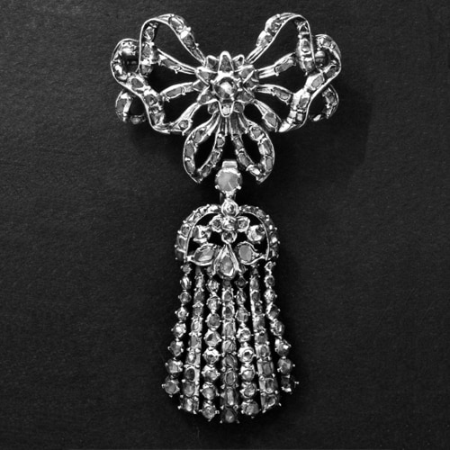 Brooch in the Form of a Ribbon-Bow Surmounting an Epaulette. Silver with a Closed-Back and Set with Diamonds. Late 18th Century © Trustees of the British Museum.