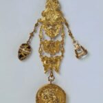 Gold and Gilt Chased, Cast and Embossed Châtelaine with Enamel Suspending a Watch, Rock Crystal Seal and a Bloodstone Egg (Equipage) c.1742. Victoria & Albert Museum Collection.