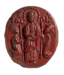 Red Glass Cameo Depicting St. James and Pilgrims c. 12th -13th Century. © Trustees of the British Museum.