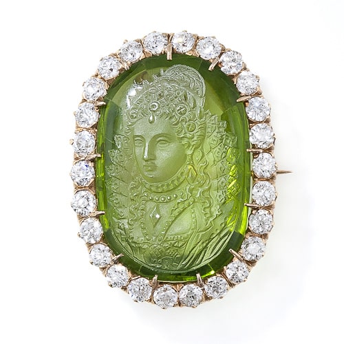 Unusual Victorian Brooch Featuring a 17.0 Carat Peridot Cameo with Diamond Surround. Image Courtesy of Lang Antiques