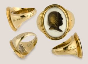 Mourning ring Honoring Jeremy Bentham, Bequeathed to John Stuart Mill, 1832. Gold with a Gold and Brown Silhouette of Jeremy Bentham on Ivory. © UCL Bentham Project.