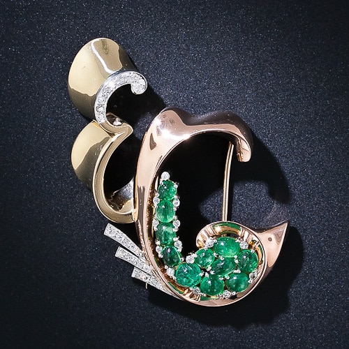 Trabert & Hoeffer-Mauboussin Reflection "E C" Emerald Brooch.