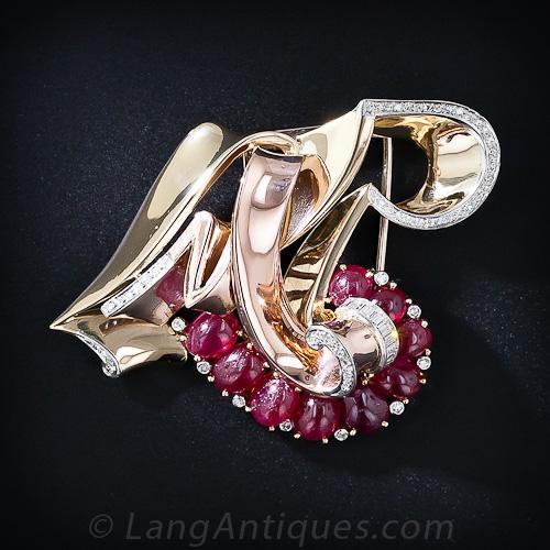 Trabert & Hoeffer-Mauboussin Reflection "L M R" Ruby Brooch.