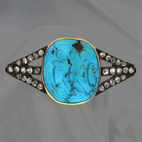 Carved Oval Turquoise with Arabic Characters Set In a Victorian Brooch.