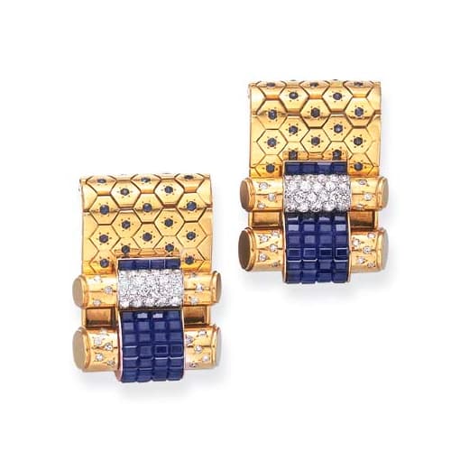 Retro Van Cleef & Arpels invisibly-set sapphire and diamond dress clips, circa 1935.