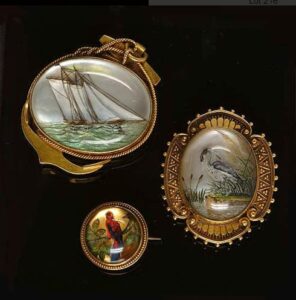 Victorian Reverse Crystal Intaglio Brooch Collection Depicting a Ship and Two Birds. Photo Courtesy of Bonhams.