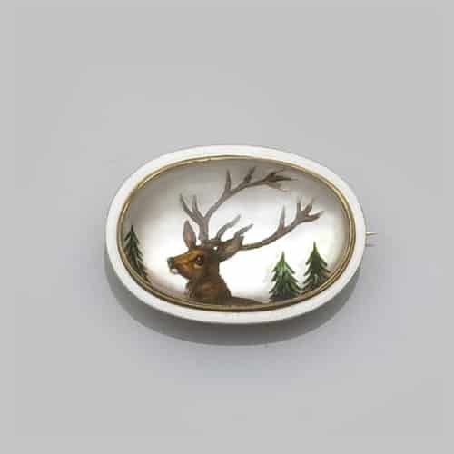 Reverse Crystal Intaglio Depicting a Deer and Framed in White Enamel. Photo Courtesy of Bonhams.