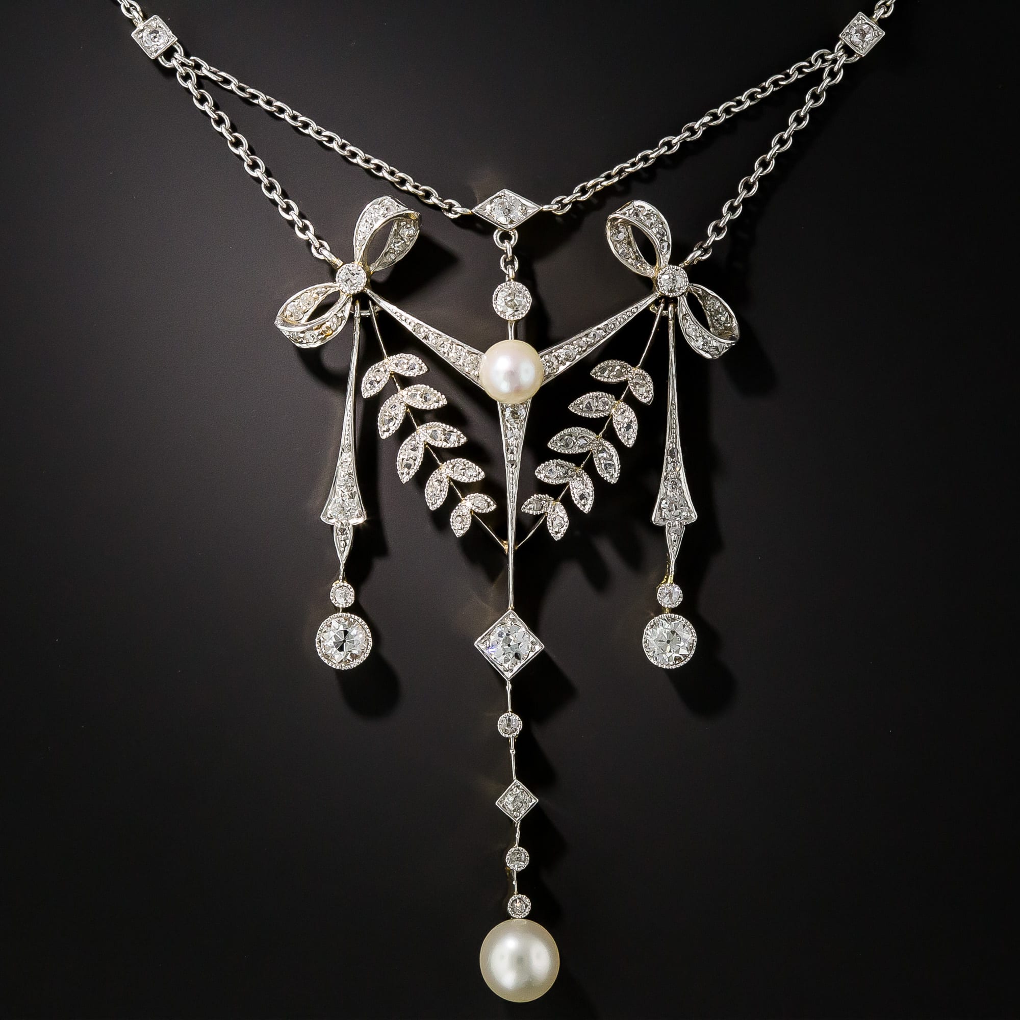Edwardian Diamond and Pearl Bow, Dart and Foliate Motif Necklace.