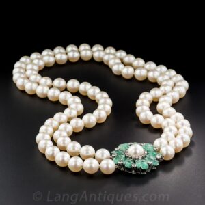 Double Strand of Cream Rose' South Sea Pearls with a Carved Emerald and Diamond Clasp.