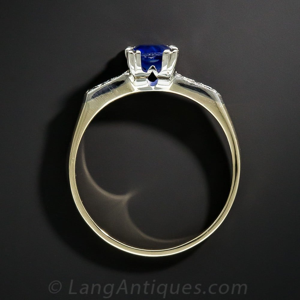 Vintage Engagement Ring with Claw-Set Sapphire.