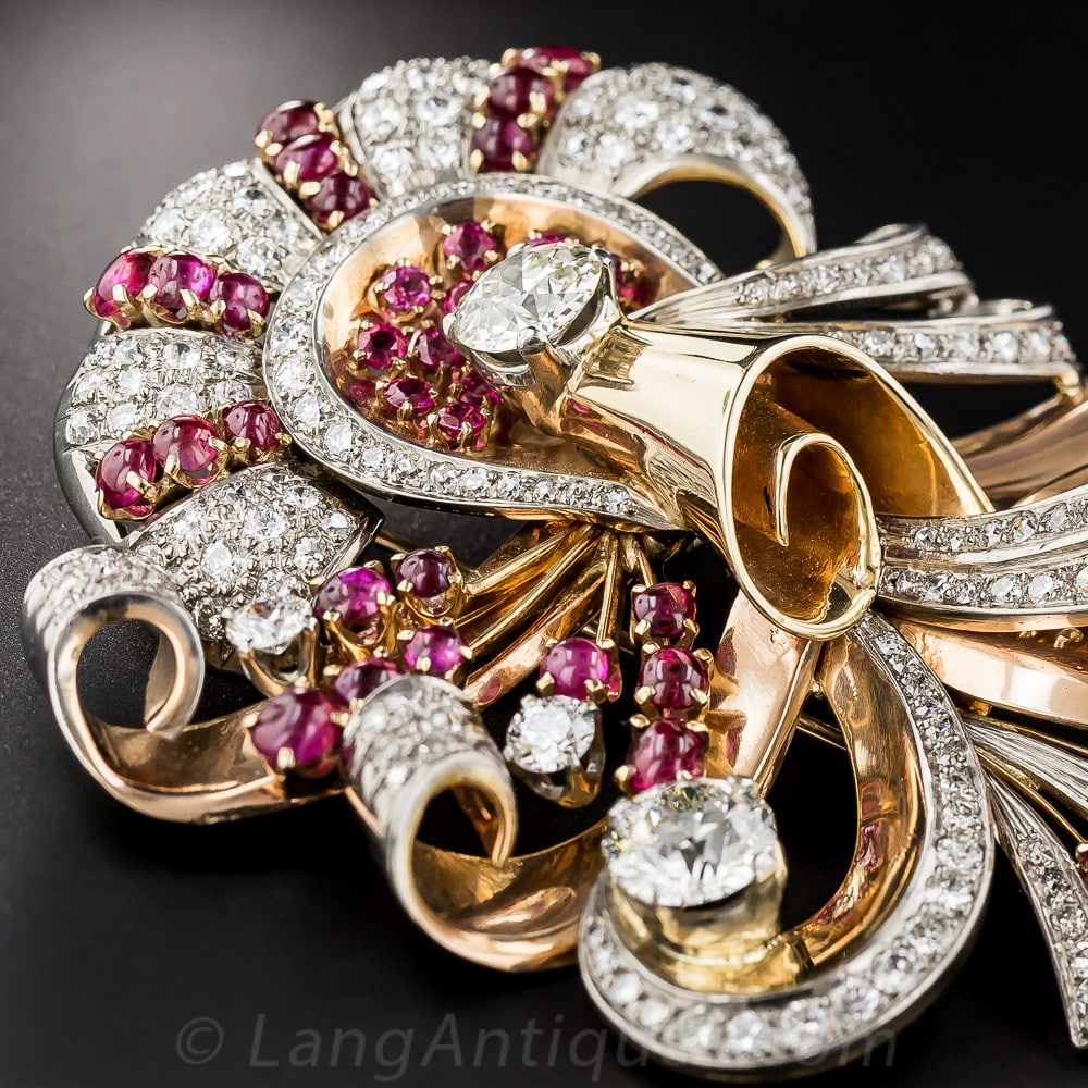 Retro Ruby and Diamond Brooch with Volute Motifs.