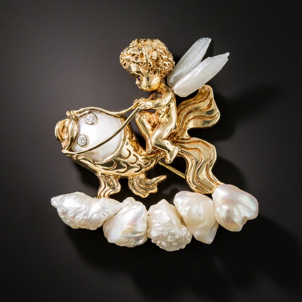 Russer Gold and Pearl Winged Putto Riding a Wave of Pearls Atop a Golden Poisson.