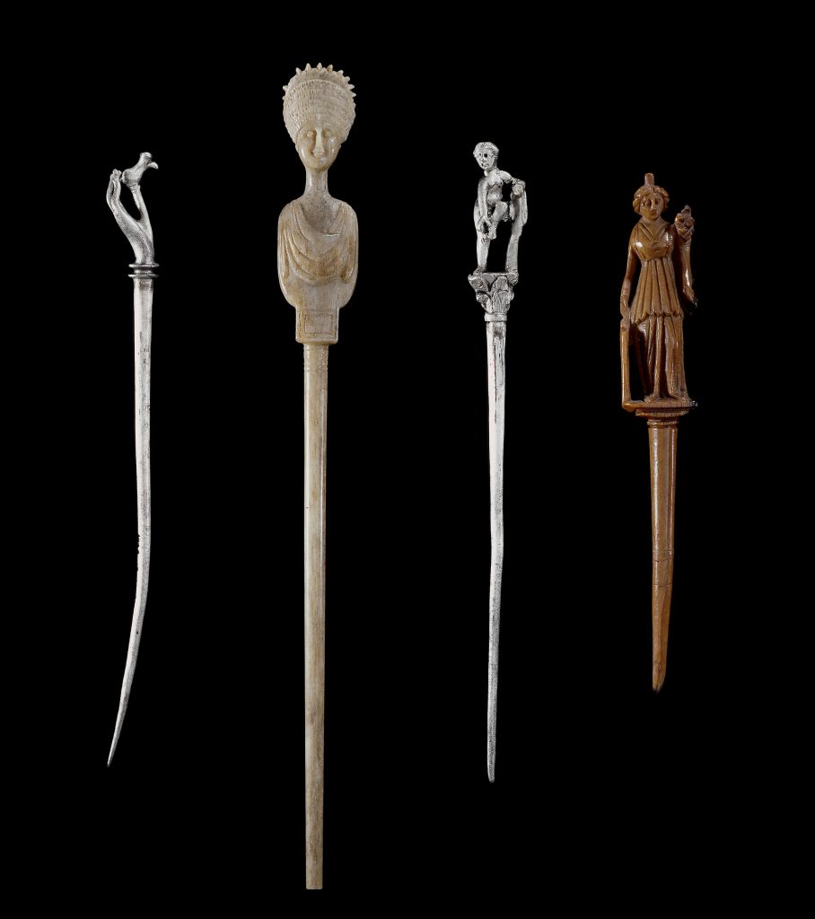 Collection of Romano-British Era Bone and Silver Hairpins (Acus Crinalis). © The Trustees of the British Museum.