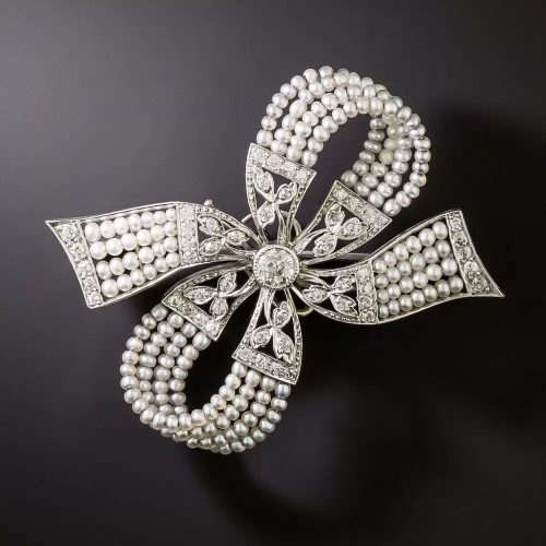 Edwardian Diamond and Pearl Bow Brooch. Edwardian Diamond and Pearl Bow Brooch.