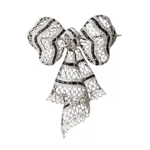 Edwardian Diamond and Onyx Bow Brooch. Edwardian Diamond and Onyx Bow Brooch.
