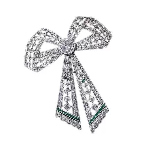 Edwardian Diamond and Emerald Bow Brooch. Edwardian Diamond and Emerald Bow Brooch.