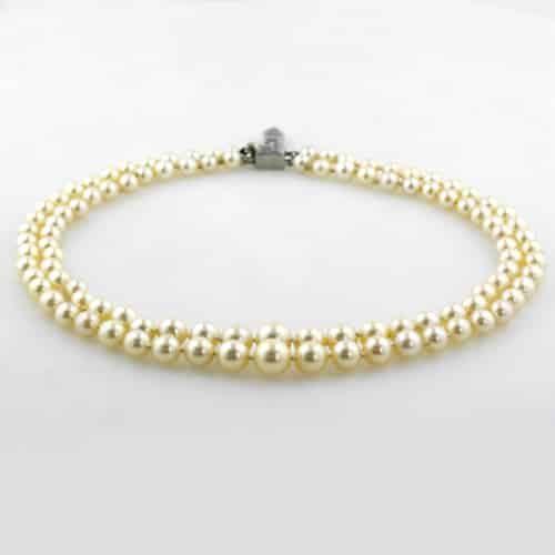 Art Deco Pearl Necklace with Cream Body Color.