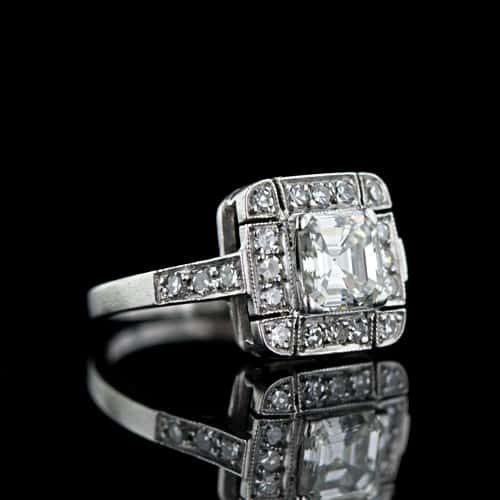 Art Deco Asscher Cut Diamond Ring with Melée Surround.