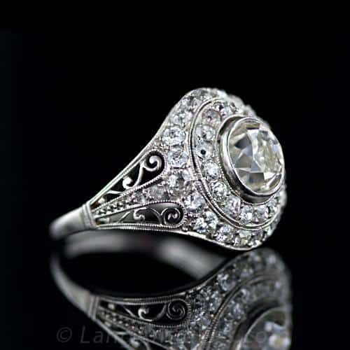 Edwardian Diamond and Platinum Domed Engagement Ring with Milgraining and Scrollwork.
