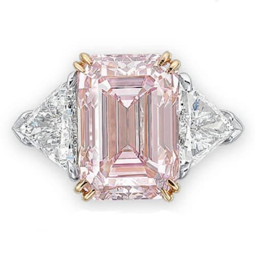 Fancy Intense Pink Diamond Ring Flanked by Diamond Triangles.