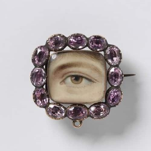 Cushion Shaped Eye Miniature Set in a Brooch with Pink Stone Frame c.1800.