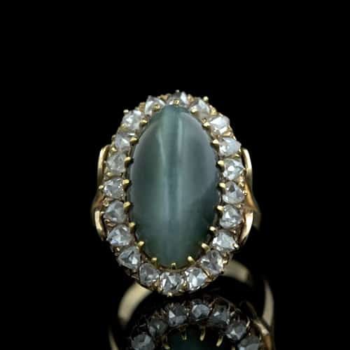 Beautiful Example of a Victorian Hawk's-Eye Ring with Diamond Surround.