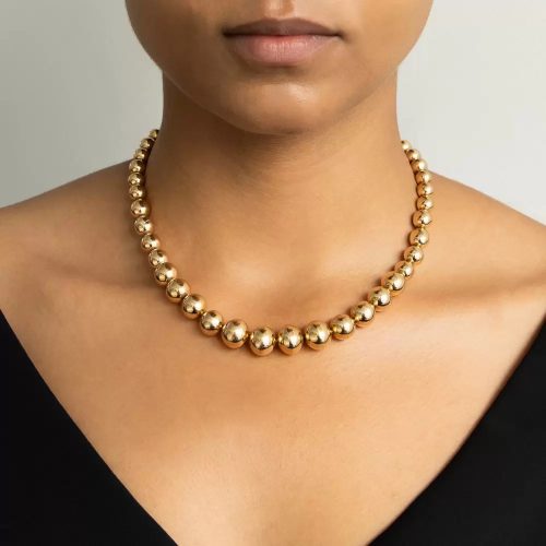 Gold Bead Necklace, Black Dress.