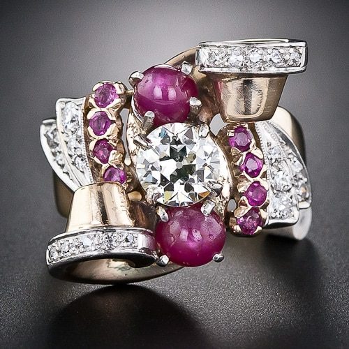 Retro Ruby and Diamond Ring with Scroll and Fan Motif Accents.