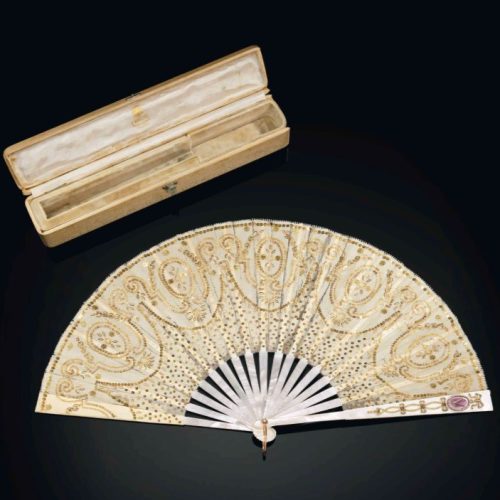 Diamond, Mother-of-Pearl, Enamel, and Bi-Color Gold Fan, Fabergé, Michael Perchin, c.1899-1903. Photo Courtesy of Christie’s. Diamond, Mother-of-Pearl, Enamel, and Bi-Color Gold Fan, Fabergé, Michael Perchin, c.1899-1903.
Photo Courtesy of Christie's.