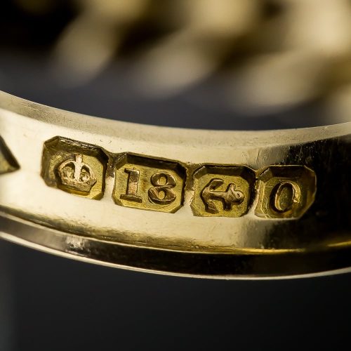 United Kingdom Birmingham Gold Hallmark (Horizontal Anchor in Cut Corner Square,) Date Letter O (1863,) Crown and 18 (18K - 1798-1974.)