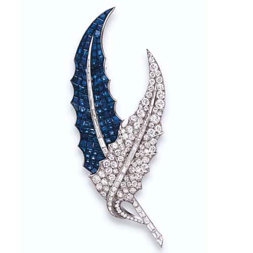 Van Cleef & Arpels Serti Mysterieux Diamond and Sapphire Leaf Brooch, c.1939. Photo Courtesy of Christie's.