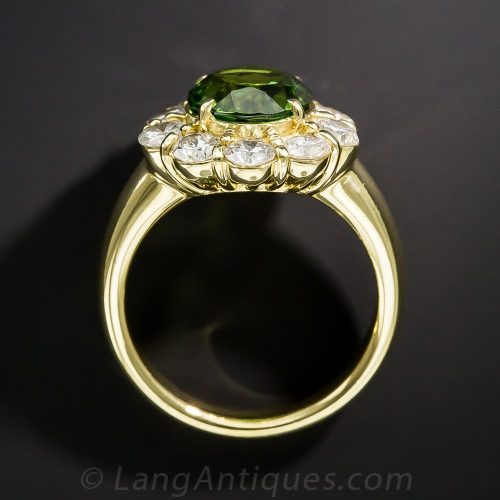 Green Tourmaline and Diamond Halo Ring. The Tourmaline Color is a More Olive Green from this Crystal Direction - Exhibiting Pleochroism.