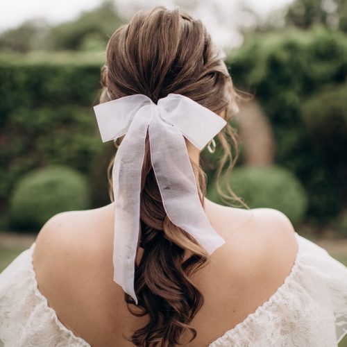 AJU Bow Blog Hairstyle with Bow. Shutterstock. AJU Bow Blog Hairstyle with Bow. Shutterstock.